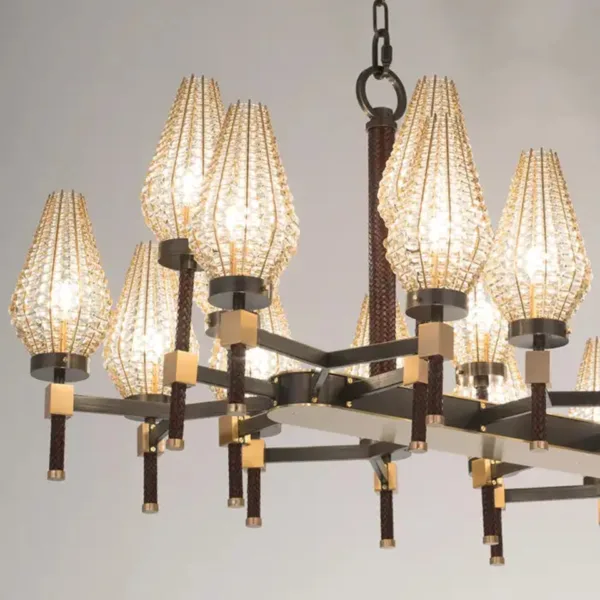 Dark metal arms, brass blocks and braided posts of the rectangular chandelier