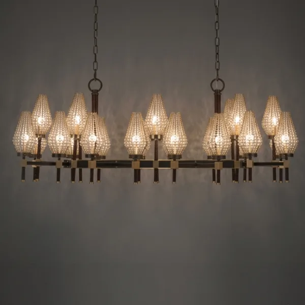 Rectangular chandelier glowing through 24 beaded shades, dark background