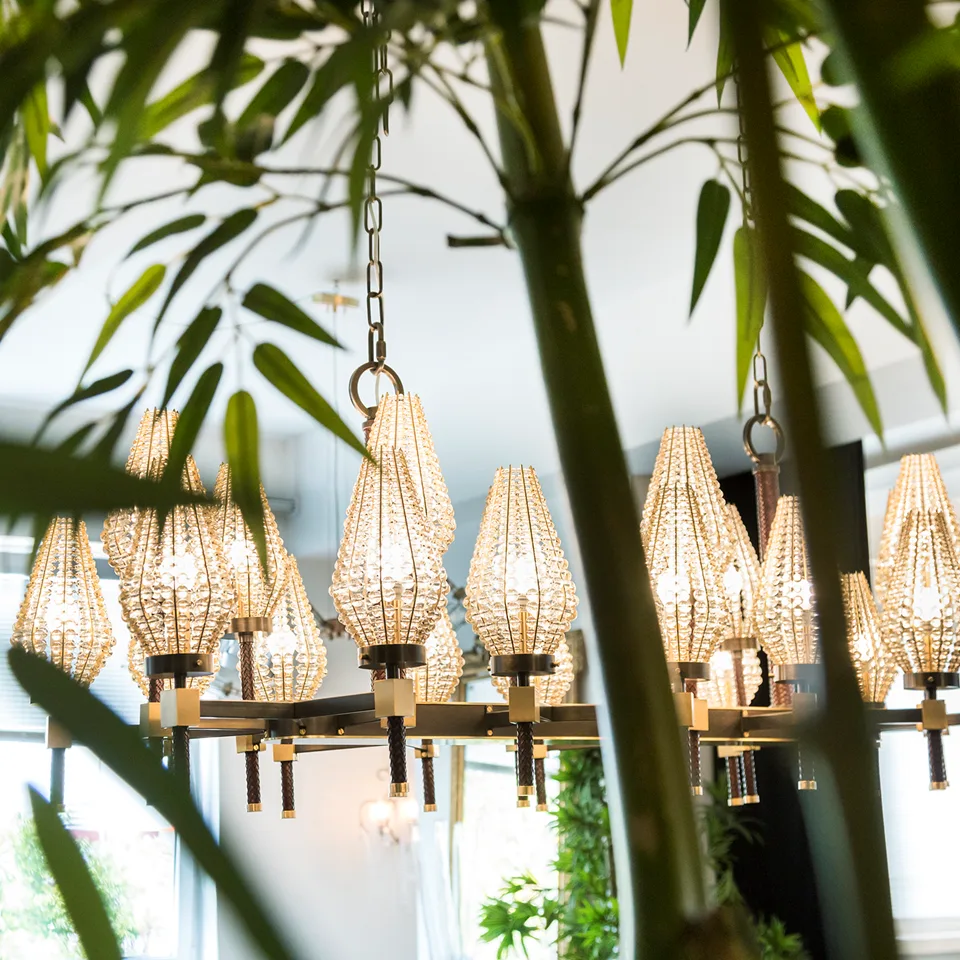 Beaded Rectangular Chandelier 7 Rectangular chandelier with beaded shades hanging among indoor plants