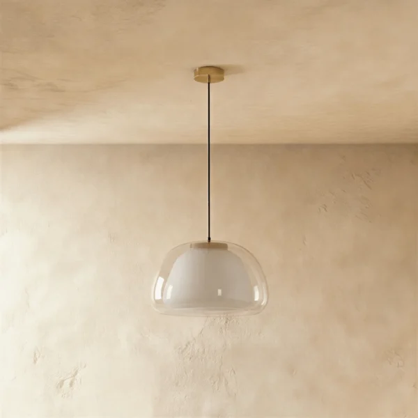 Double glass pendant light unlit, showing the clear outer glass over the white opal inner shade and gold canopy