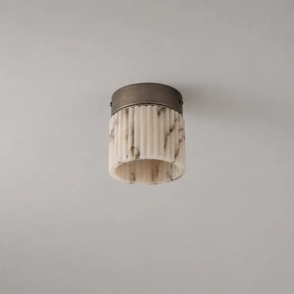 Small alabaster fluted light on a plain grey ceiling, seen from below
