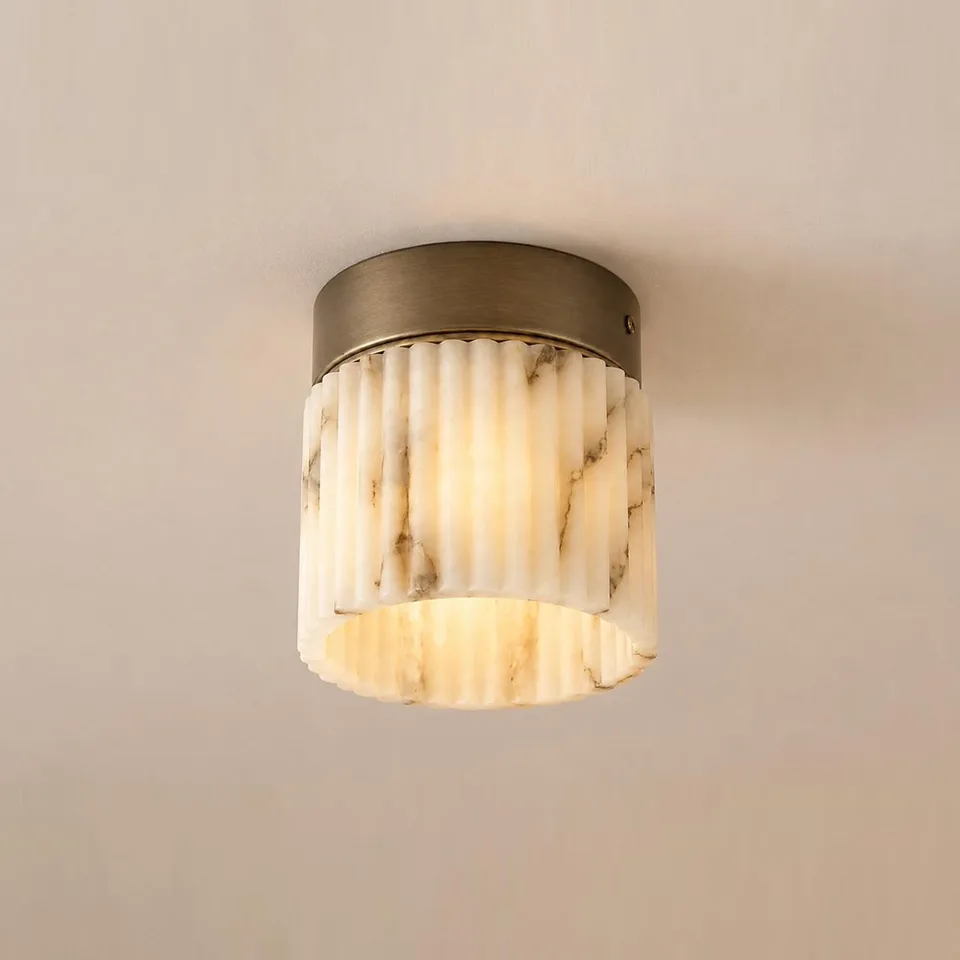 Home 5 Fluted light in real alabaster, a small flush mount ceiling light under a round antique bronze-finish canopy
