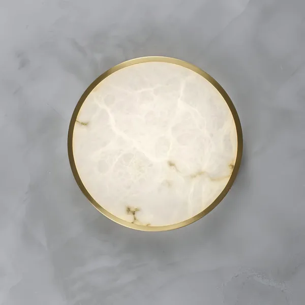 Round alabaster ceiling light glowing to show its veining