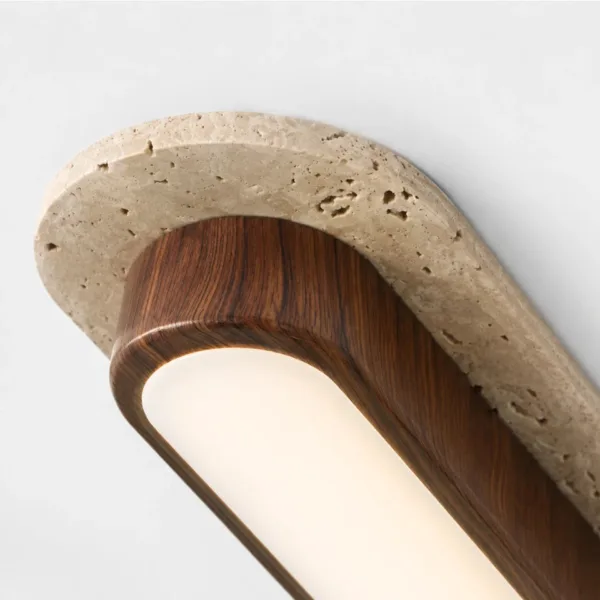 Close-up of the honed travertine rim with natural pits over the wood body and white diffuser