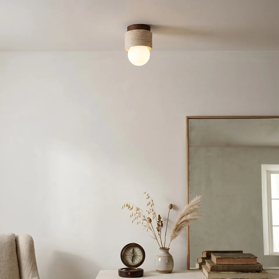 Travertine Ceiling Light – Mini Flush Mount with Opal Globe, 12 cm 9 Mini travertine ceiling light above a calm living room corner