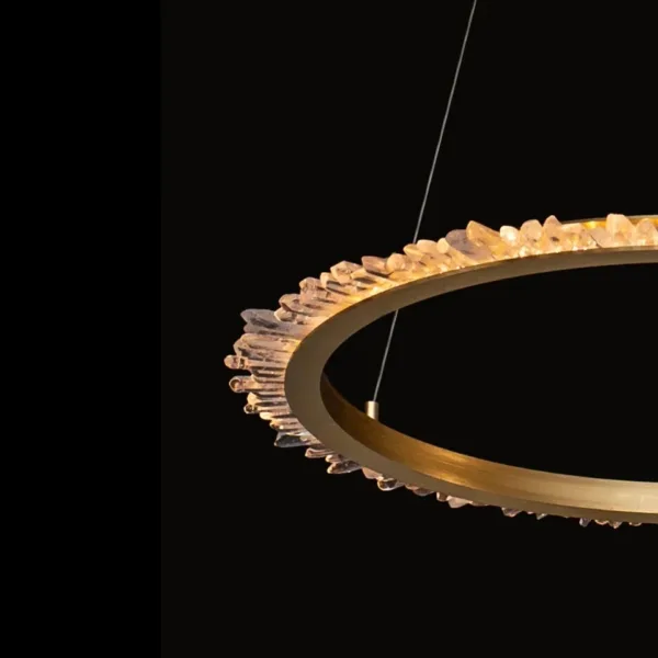 Brushed brass ring edge with lit crystal points, close-up