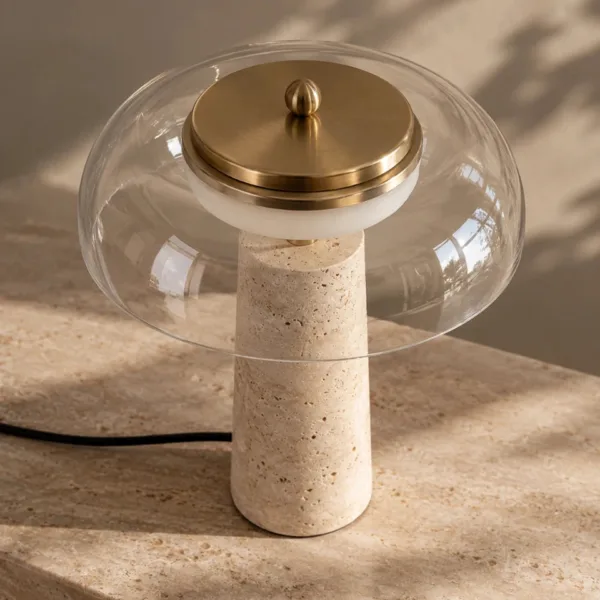 Clear borosilicate glass dome with the brass-finish LED disc and top knob of the table lamp