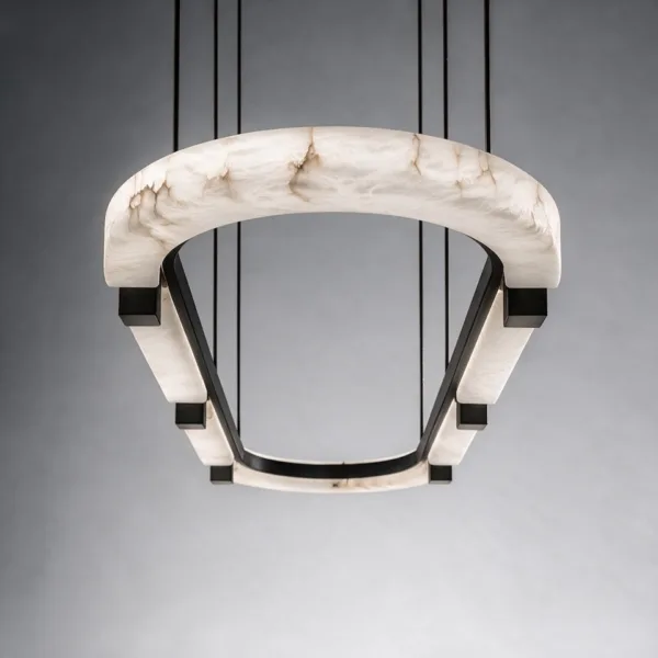 Curved end of the alabaster ring held by dark metal clamps