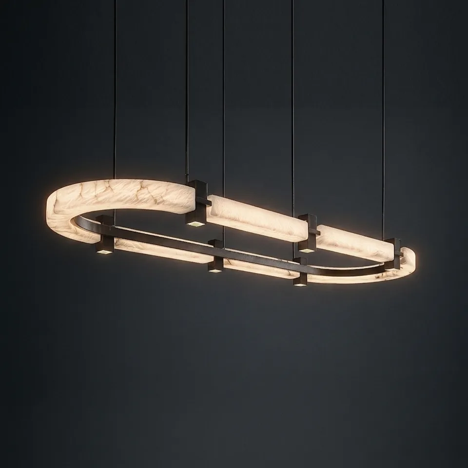 Oval alabaster chandelier glowing warm white against a dark wall