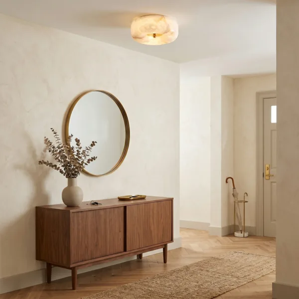 Alabaster pebble ceiling light in a warm foyer with a sideboard