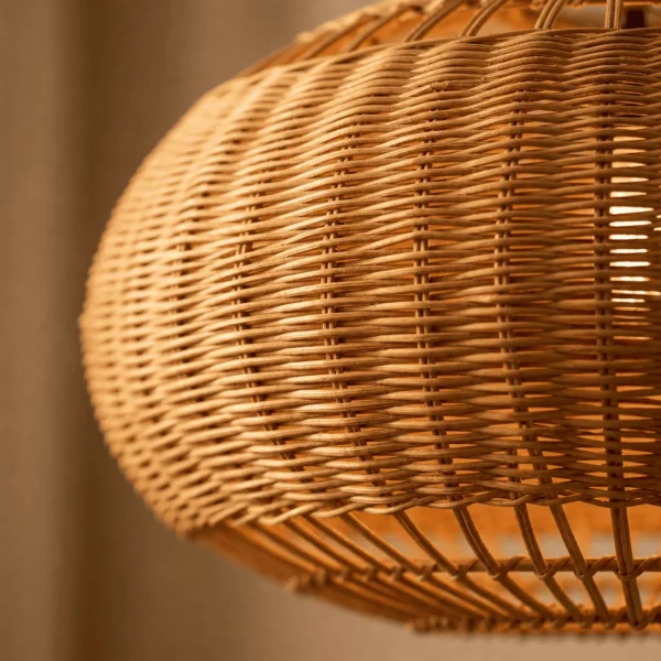 Close-up of the hand-woven rattan strands and open lower rods of the rattan globe pendant light