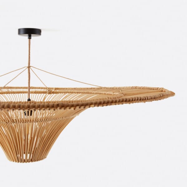 Rattan pendant lamp on its matte black canopy, rattan-wrapped cord and support strings
