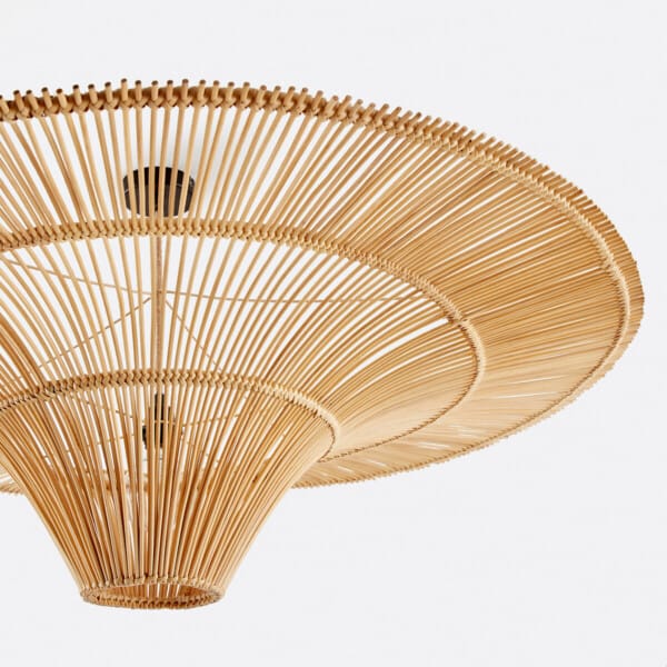 Underside of the rattan pendant lamp showing the open rods, hand-bound rings and central cone