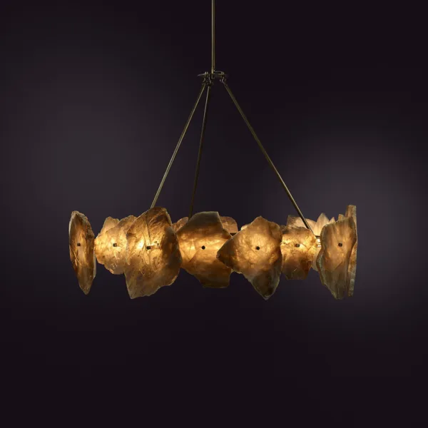 Raw-edged alabaster stone chandelier with a warm amber glow