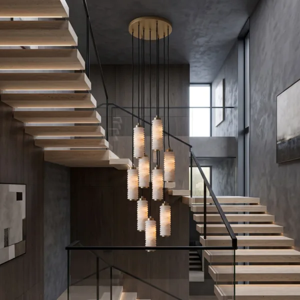 Ribbed alabaster chandelier hanging beside a floating staircase with glass railing