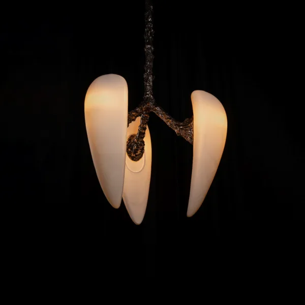 Alabaster drops on textured metal arms, close-up