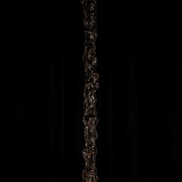 Hand-worked texture of the sculptural chandelier stem, close-up