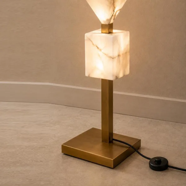 Alabaster cube, brass-finish base and foot switch of the floor lamp