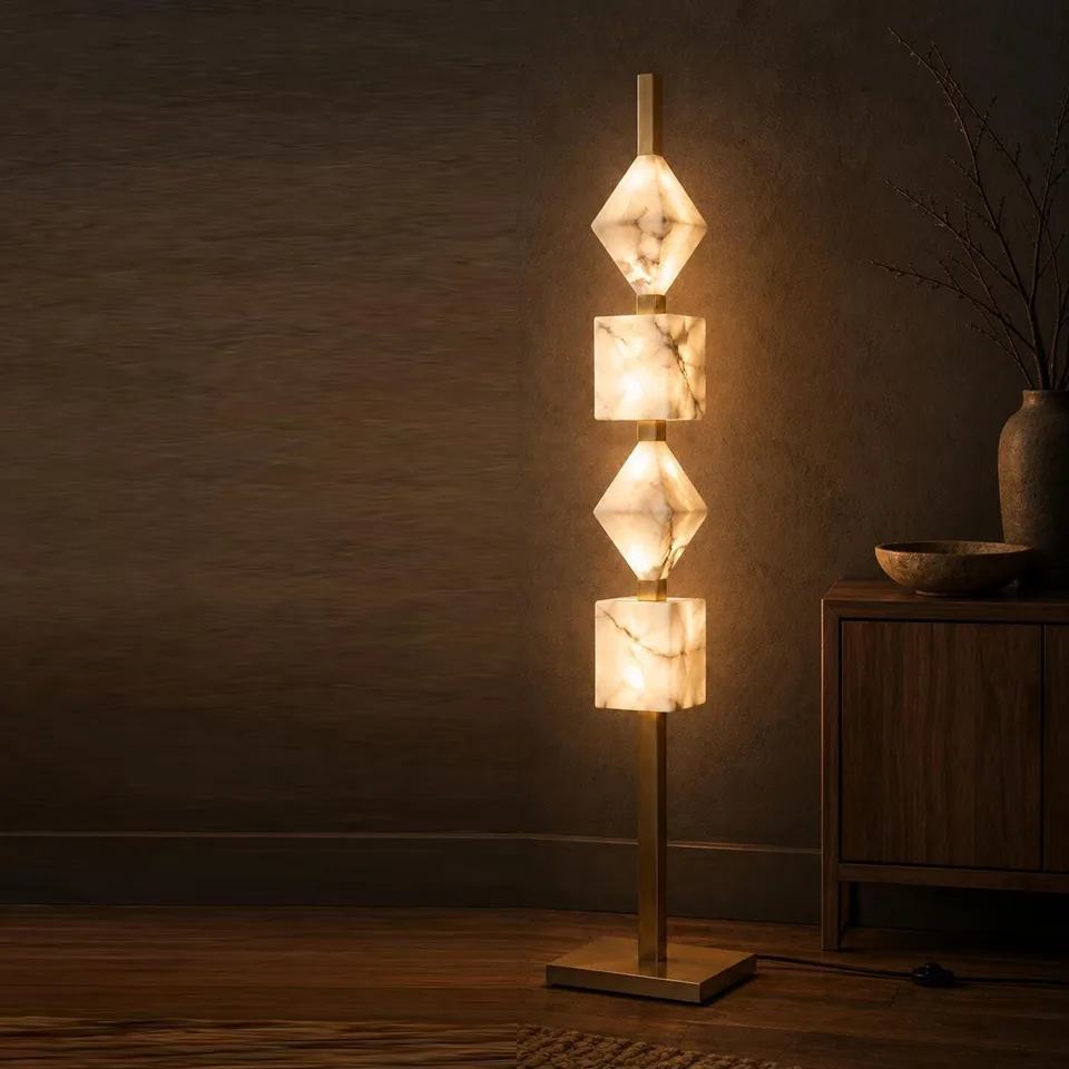 Designer Floor Lamp – Stacked Alabaster Column, Built-in Warm LED, 152 cm 5 Alabaster column floor lamp lit in a dark room beside a wooden sideboard