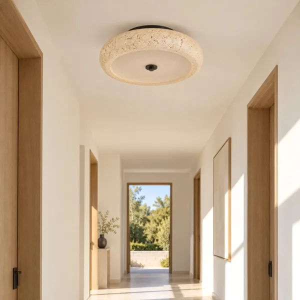Corridor light: travertine ceiling lamp near a garden door