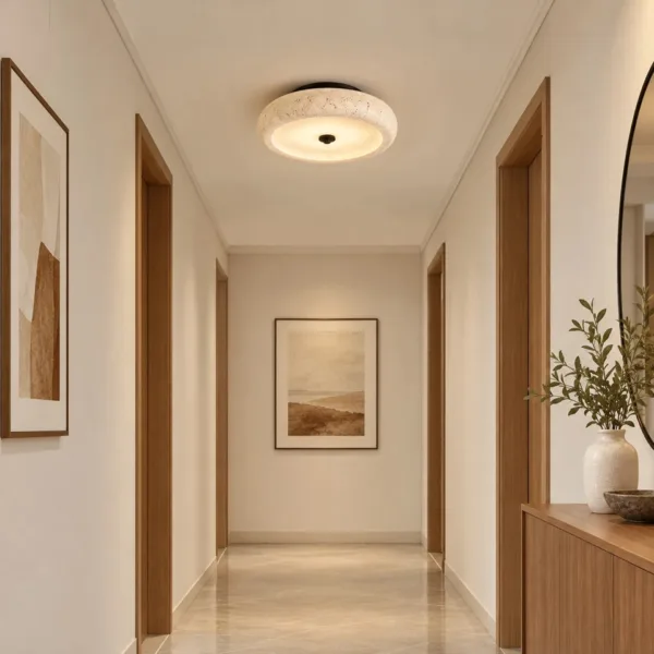 Passage light: travertine ceiling lamp in a bright hallway