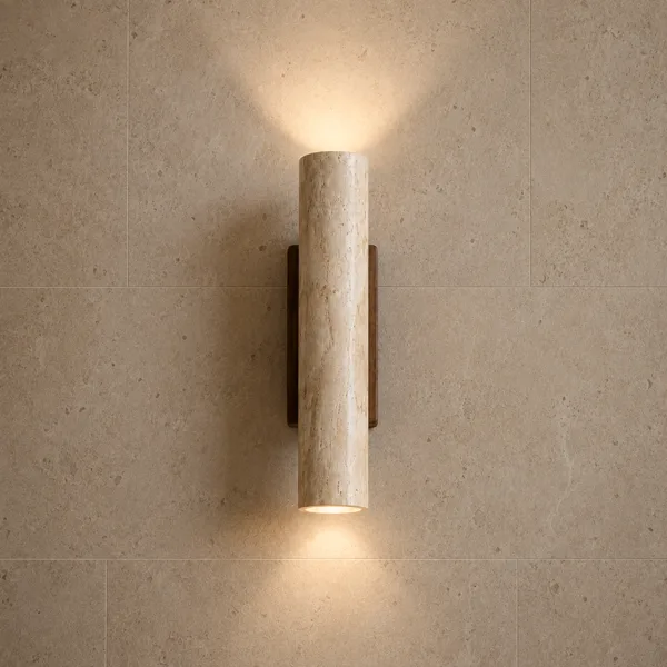 Travertine wall light washing warm light up and down a stone-tiled wall