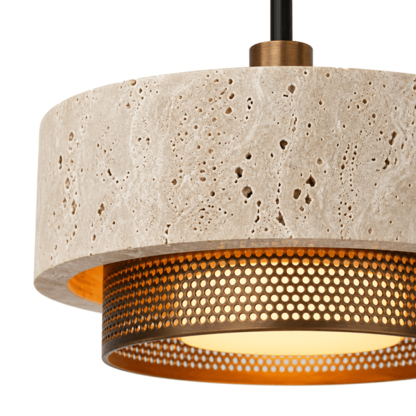 Close-up of the travertine mini pendant light: pitted stone drum and perforated copper-bronze stainless steel ring lit from inside
