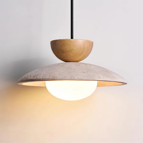 Travertine stone shade with an opal borosilicate glass globe glowing warmly beneath a wood cap