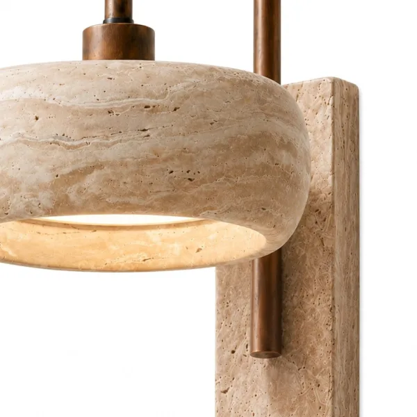 Close-up of the travertine drum, travertine backplate and antique bronze stainless steel arm