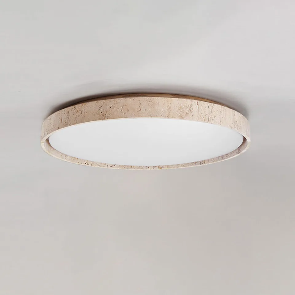 LED ceiling light with a natural travertine ring on a plain ceiling