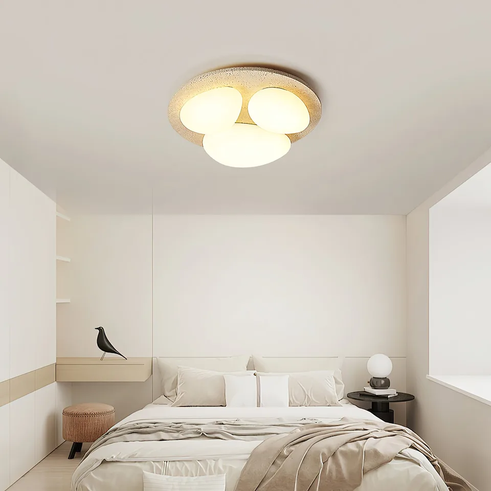 Travertine Ceiling Light – Three Pebble Flush Mount, 50 cm 6 Bedroom ceiling light design: travertine pebble light above a bed