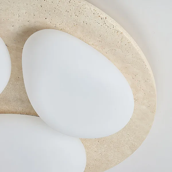 Close-up of the travertine disc and a white pebble diffuser