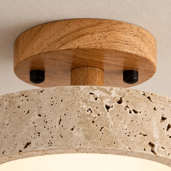 Oak-tone wood canopy and stem with black caps above the travertine ring