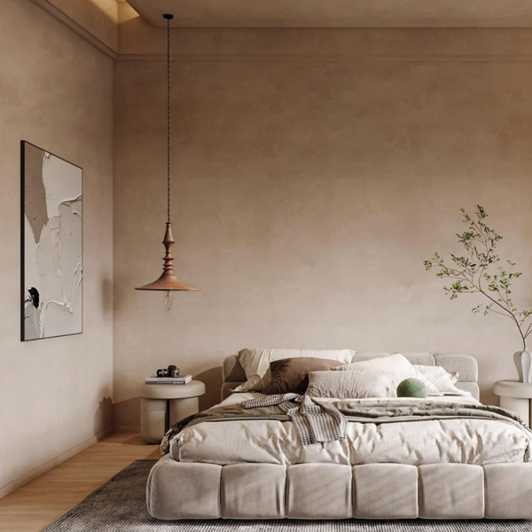 Turned wood pendant light hanging in the corner of a calm neutral bedroom