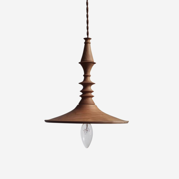 Turned wood pendant light with carved rings and a flared brim on a twisted brown cord, on a white background