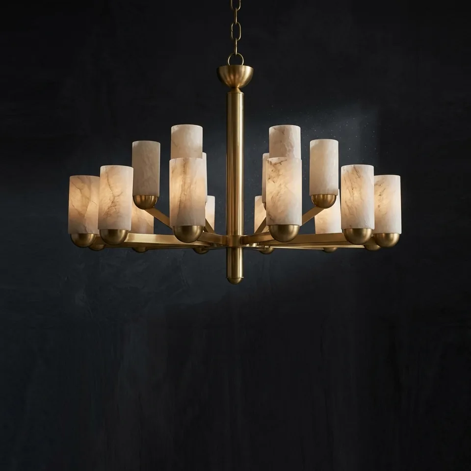 Two-tier alabaster brass chandelier with 18 lit cylinders against a dark wall